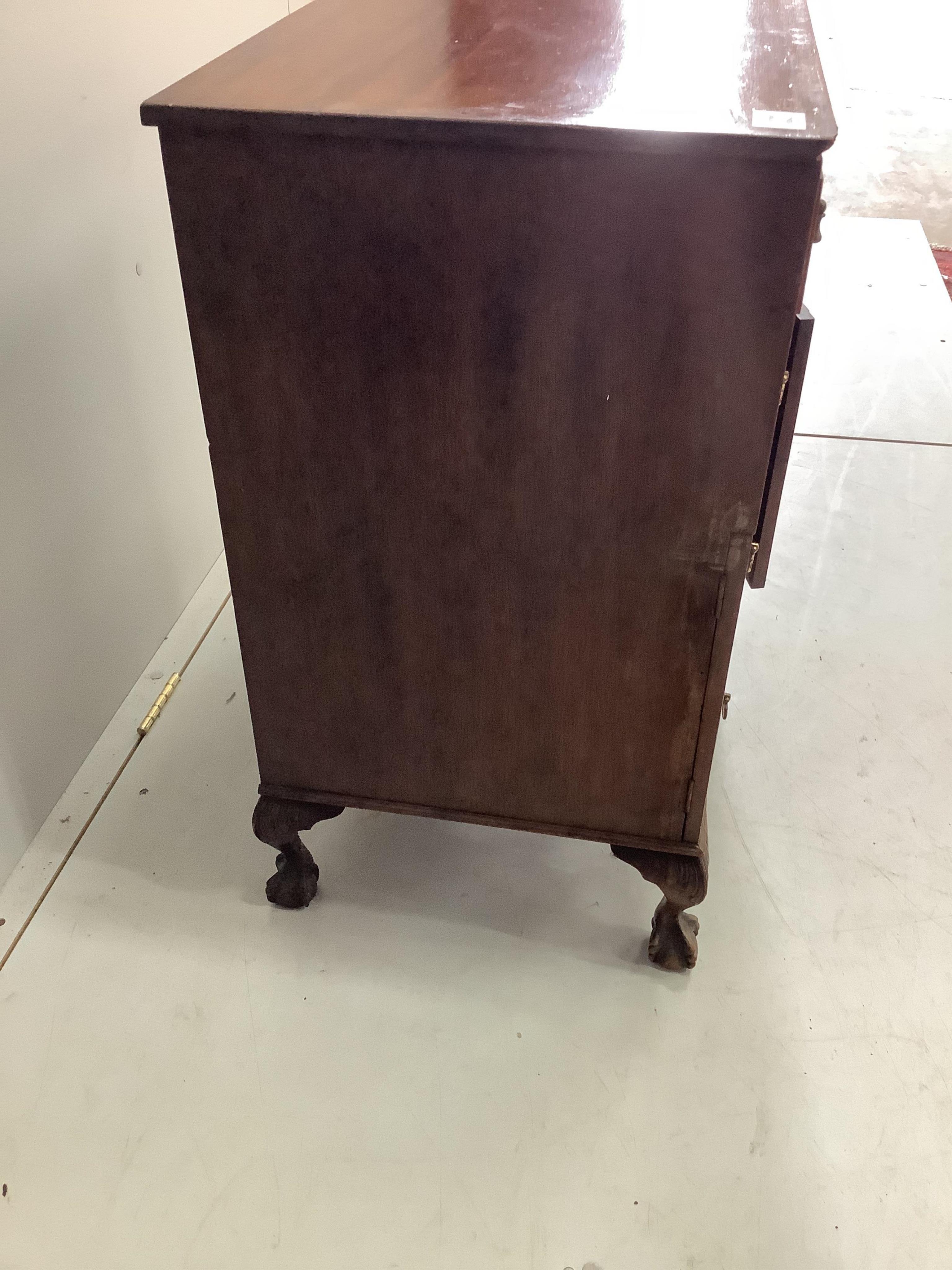 A small George III style mahogany kneehole desk, width 61cm, depth 43cm, height 77cm. Condition - poor to fair